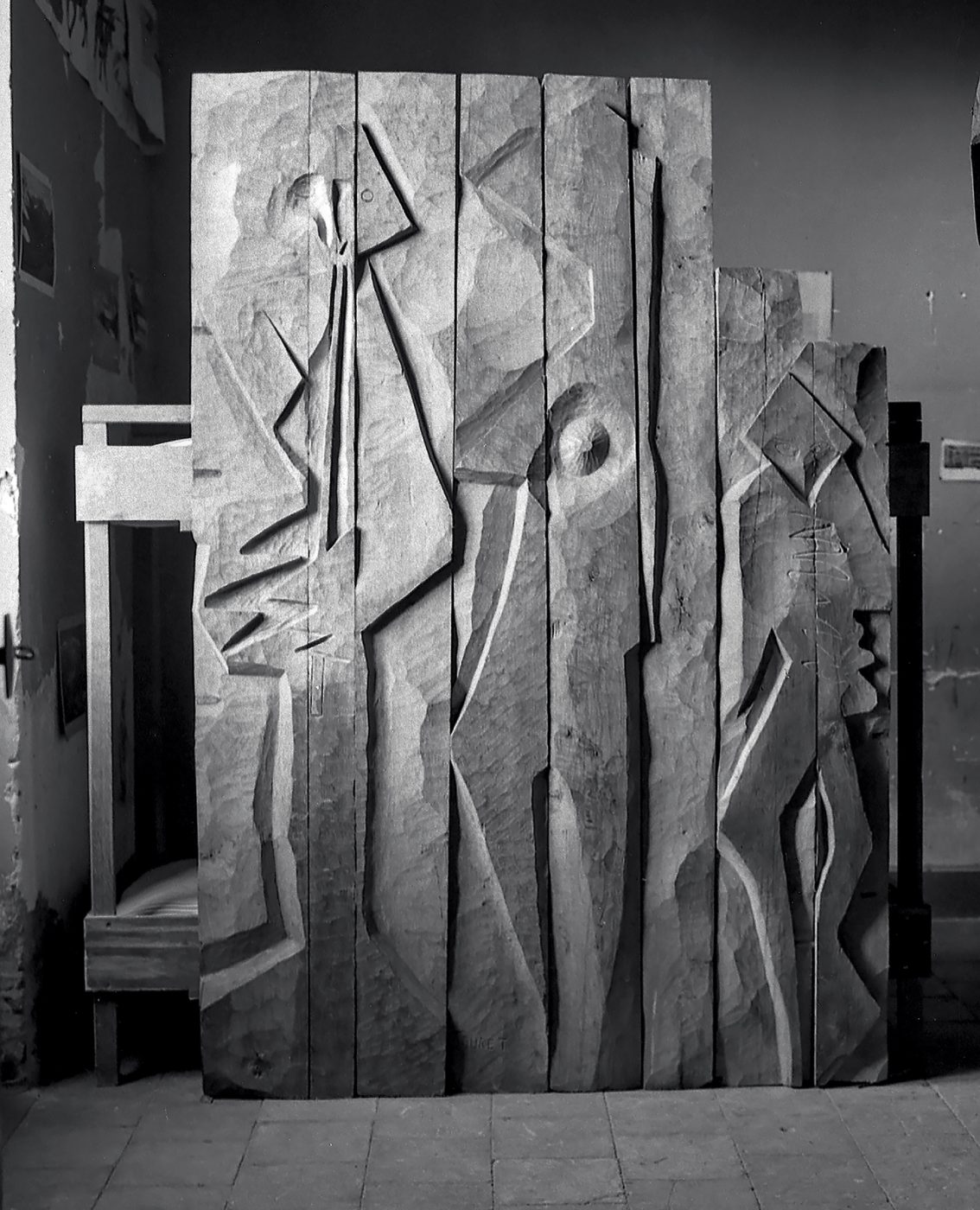 A black and white photo of "The Musicians", circa 1970, was carved from oak staves