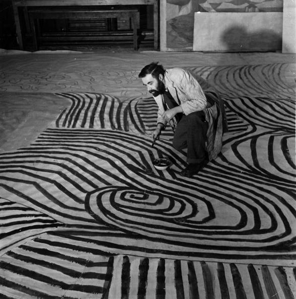 Victor Pasmore painting a massive abstract work on a restaurant floor for the 1951 Festival of Britain.