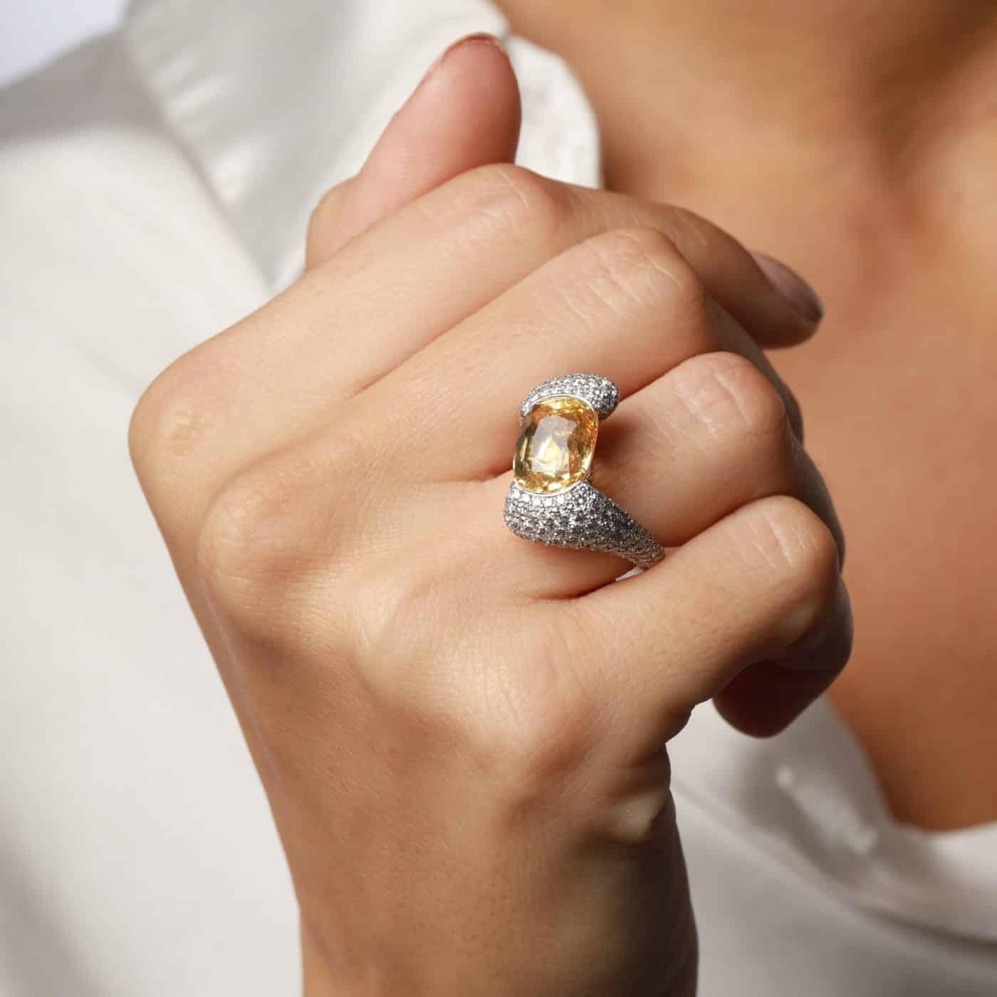 9.18-carat yellow oval sapphire and diamond cocktail ring