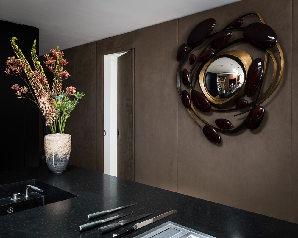 Hervé Van der Straeten’s Tumulte mirror in the kitchen