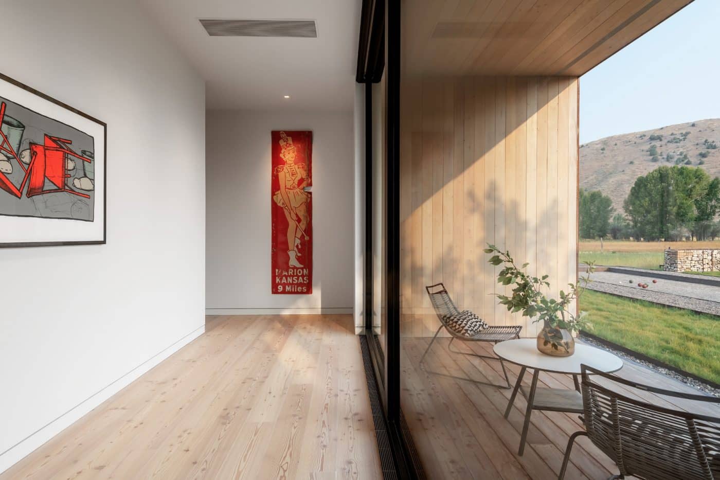 A hallway in Dogtrot house decorated with artwork