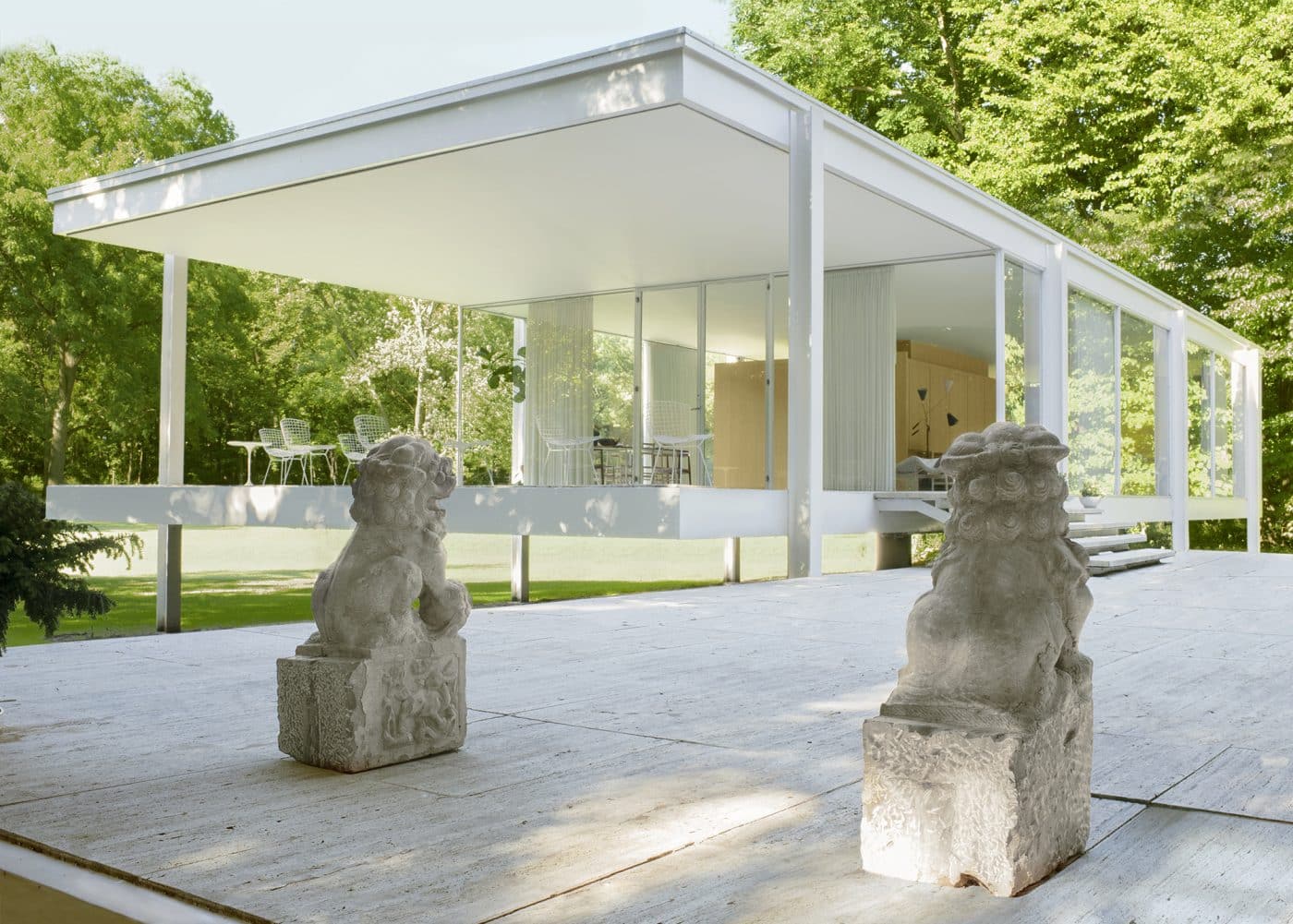 Pair of Fu dogs from Pagoda Red outside of an exhibition at Ludwig Mies van der Rohe’s iconic Farnsworth House, in Plano, Illinois