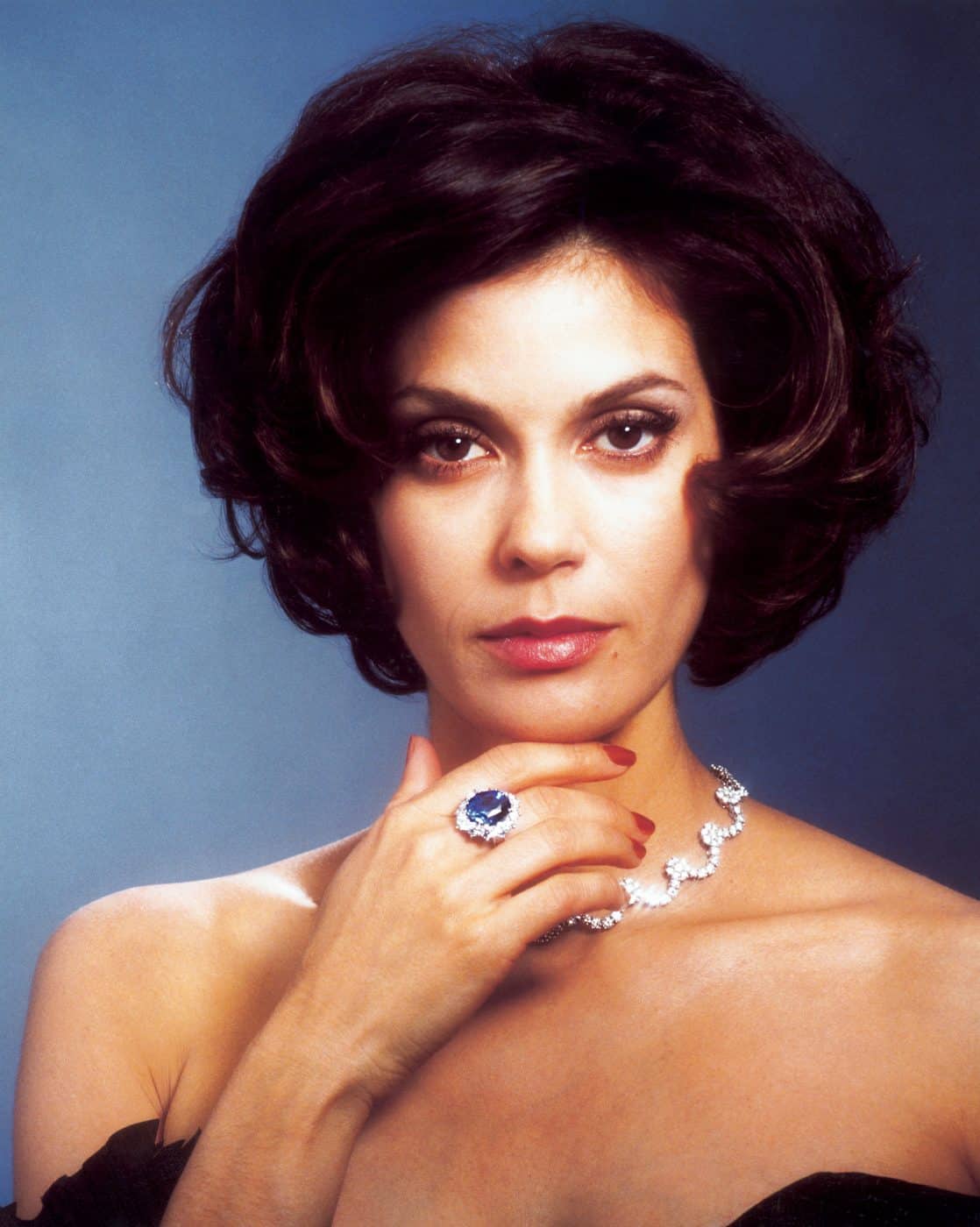 Photo of actress Teri Hatcher in a diamond scoop necklace and a Burmese sapphire ring in the 1997 James Bond film Tomorrow Never Dies.