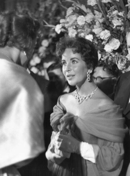 Elizabeth Taylor wearing Cartier jewelry in 1957