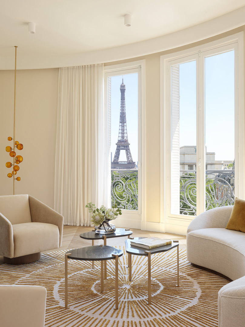 Smaller sitting room with a view of the Eiffel Tower designed by Damien Langlois-Meurinne