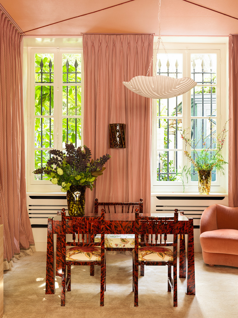 a pair of Pondichery chairs and a Madras armchair are lacquered with a tortoiseshell pattern at the back of the gallery