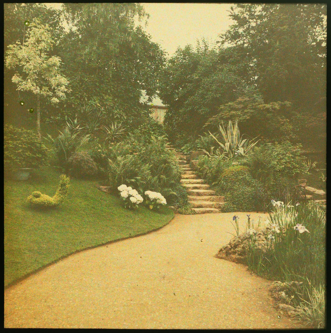 A pair of early color photographs commissioned by Alice de Rothschild in about 1910 showing the Red Sitting Room on Waddesdon Manor's second floor and the Dairy on its large acreage part of the show "Alice's Wonderlands" about Alice de Rothschild England