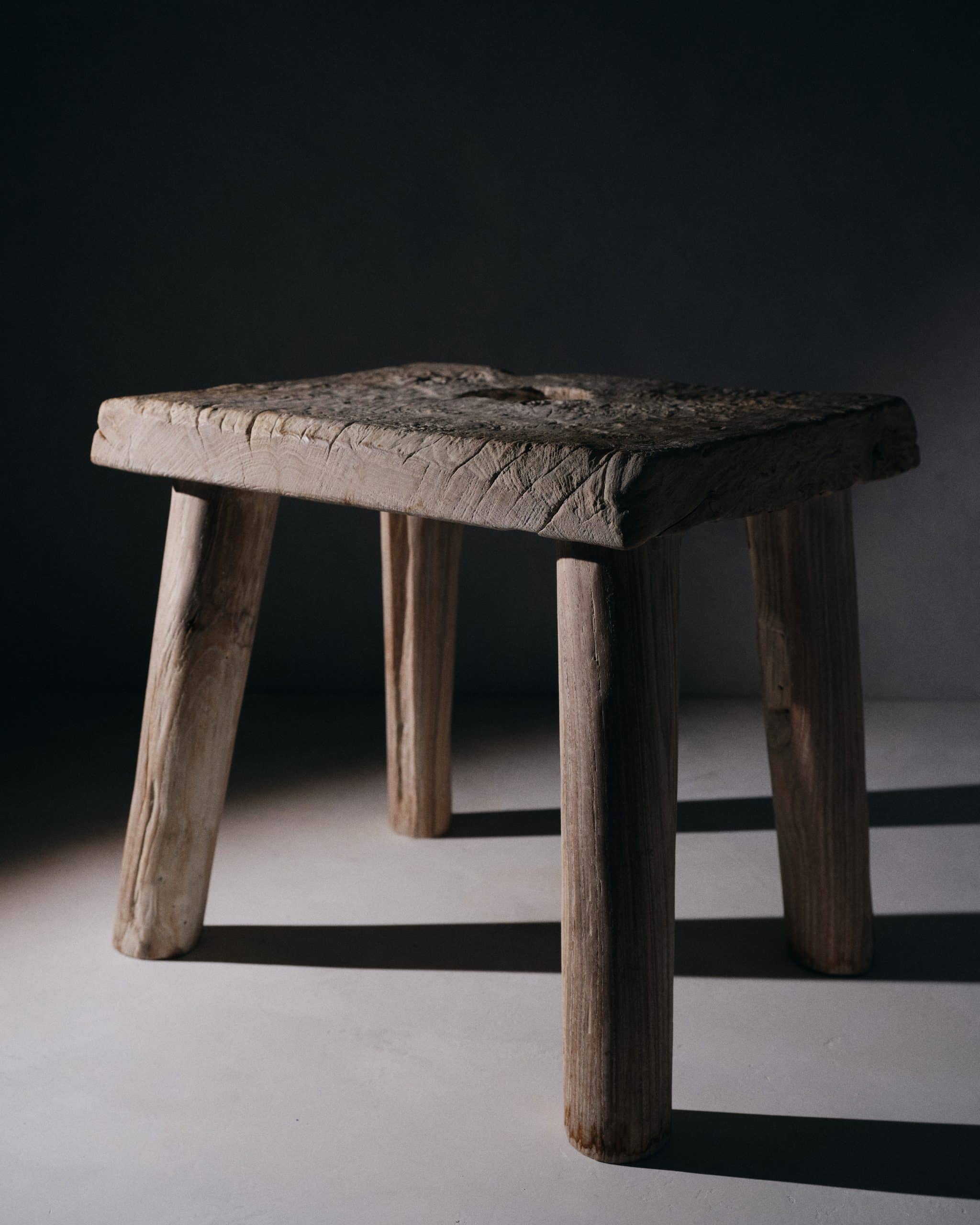 A rustic teak stool by Andrianna Shamaris