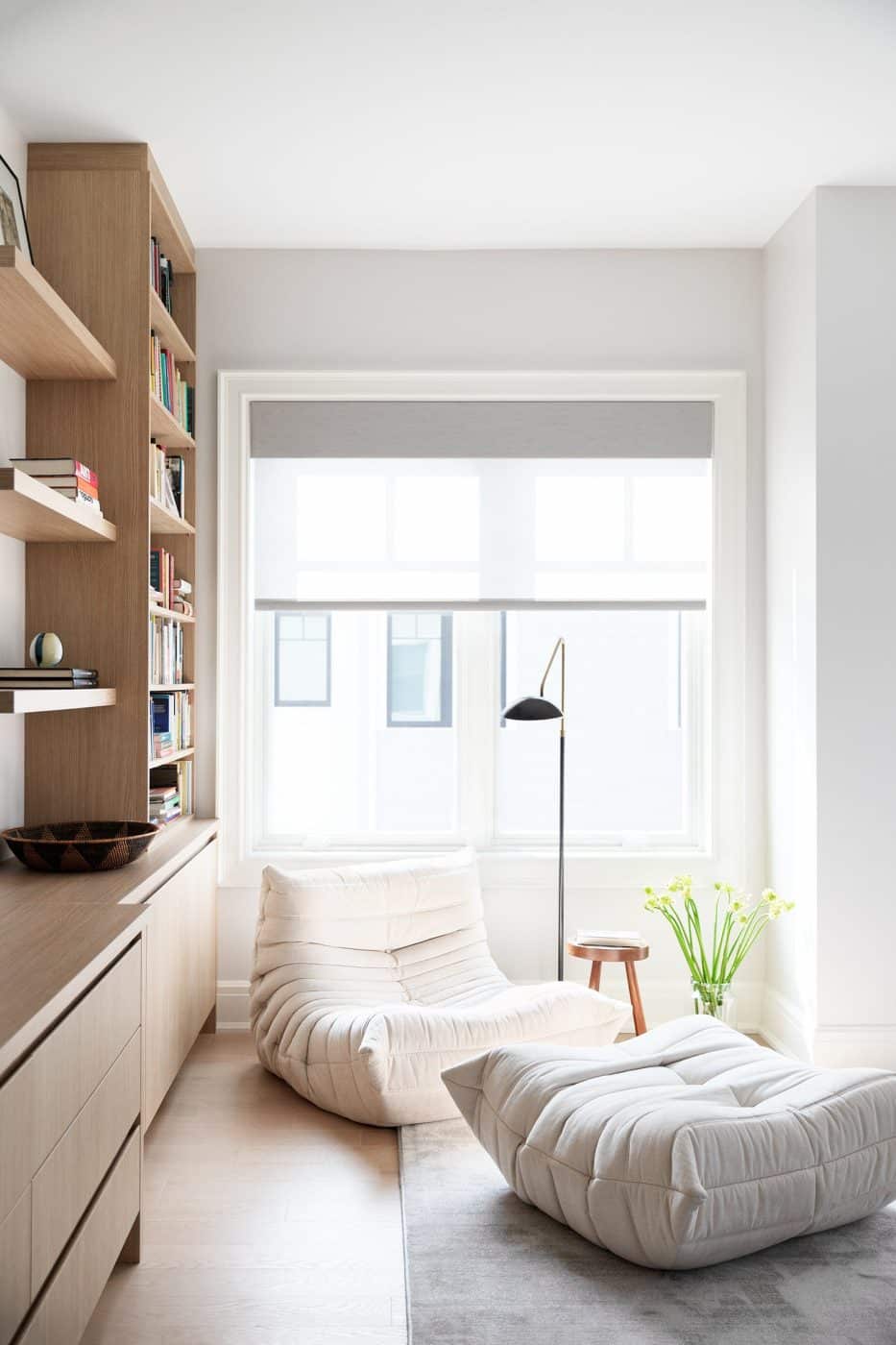 Apartment by Sharon Rembaum with white Ligne Roset chair and ottoman