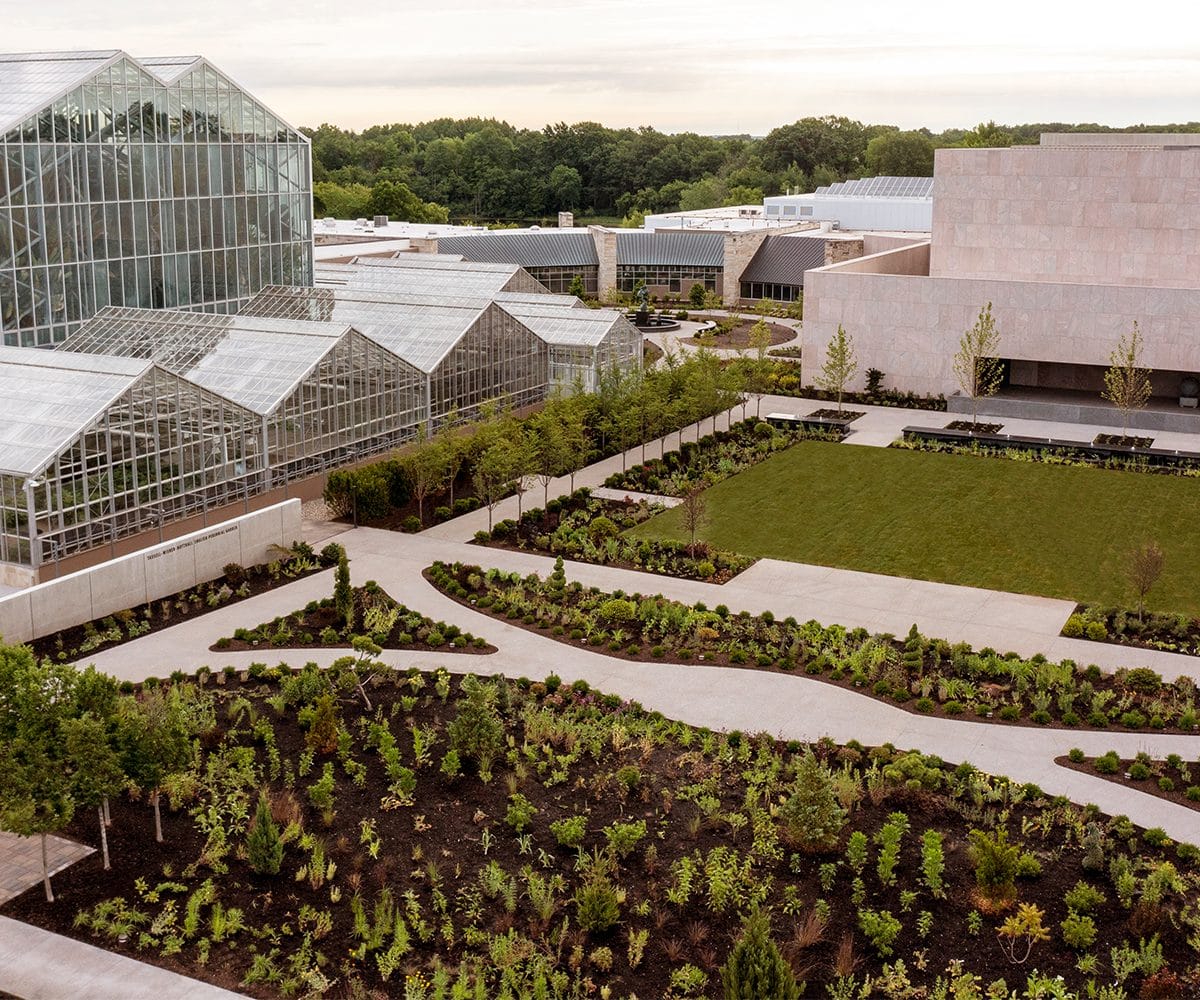 Frederik Meijier Gardens and Sculpture Park Grand Rapids English perennial garden in foreground, five-story tropical conservatory at right new welcome center by Tod Williams Billie Tsien architects behind