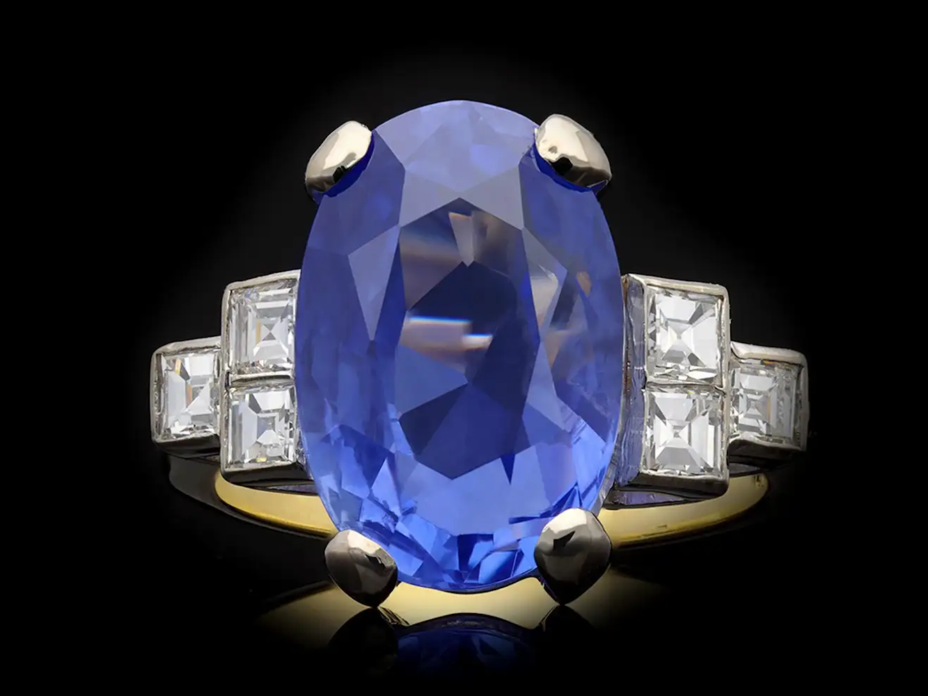 Ceylon sapphire and diamond flanked solitaire ring, circa 1920