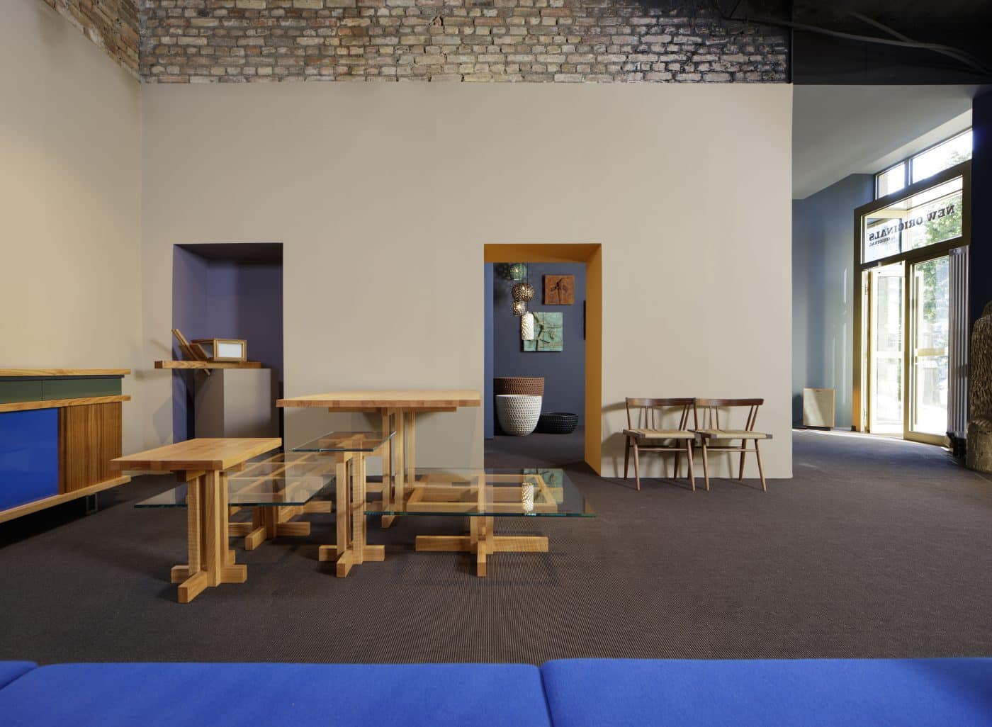 George Nakashima Studio chairs and Ray Kappe tables in Original in Berlin's New Originals gallery space