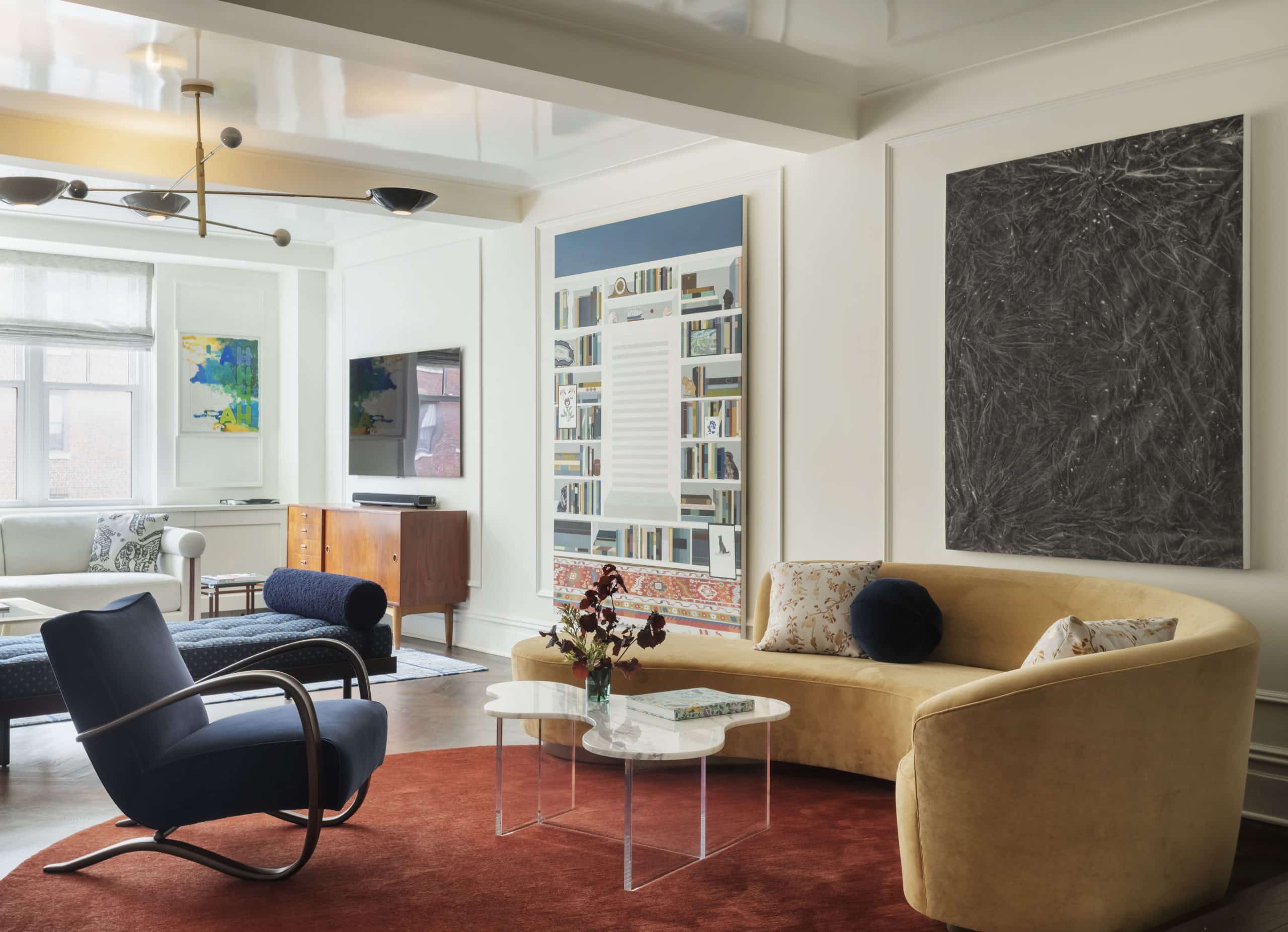 Living room of a Studio DB-designed Upper West Side prewar apartment in New York City with art by Mel Bochner Becky Suss Sam Moyer and a Vladimir Kagan style couch sofa
