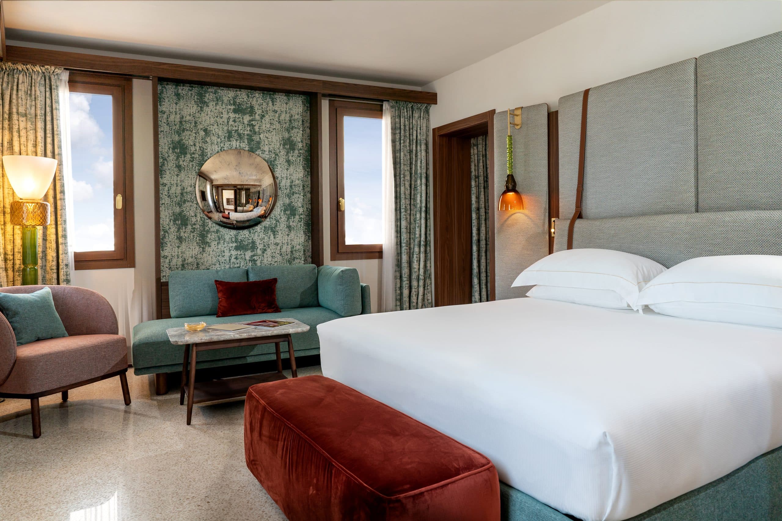 Venice's new Ca' di Dio hotel guest room with custom beds, armchairs, sofas and small tables Patricia Urquiola designed with Molteni
