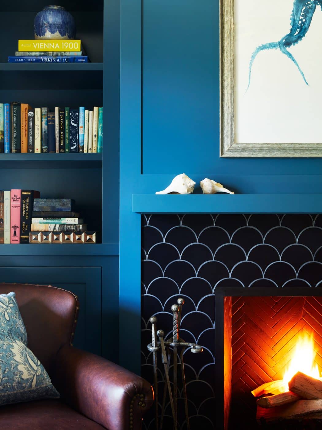 blue den with fireplace by Carrier and Company