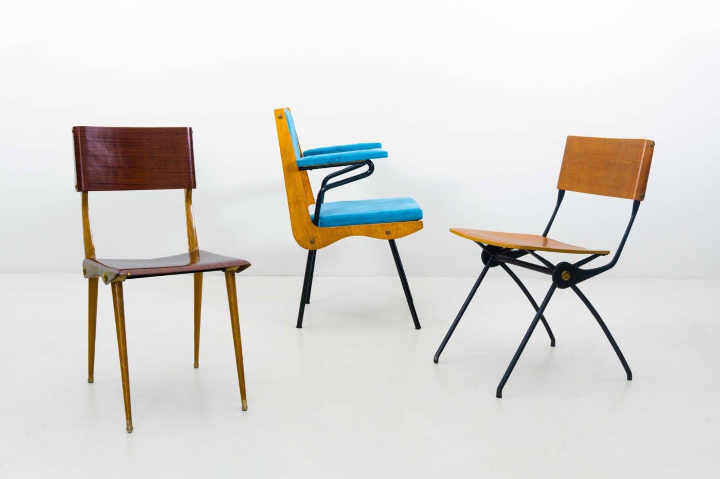 A trio of mid-century chairs by Carlo de Carli