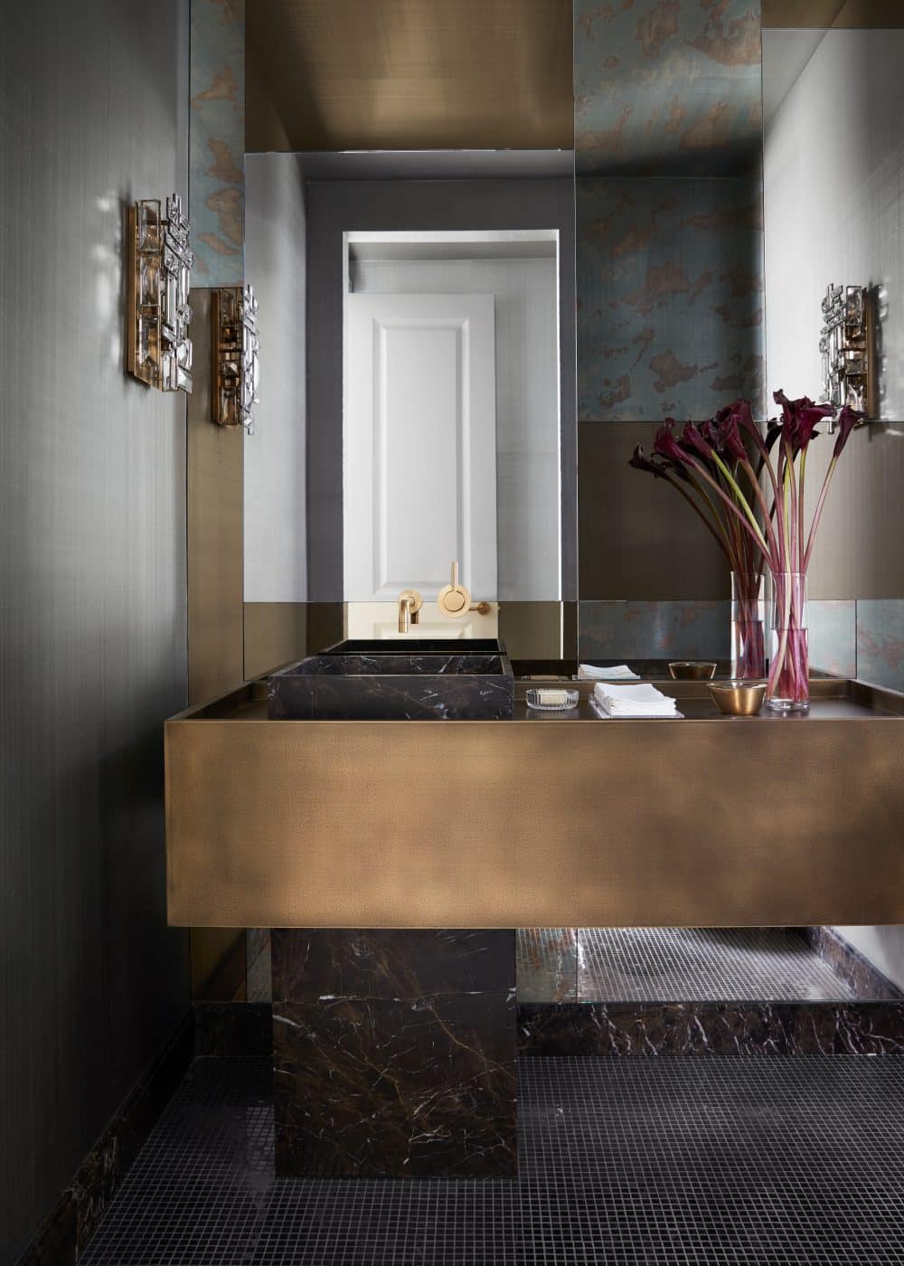 Powder room with brass-framed vanity in Manhattan apartment designed by Drake/Anderson's Caleb Anderson Jamie Drake 