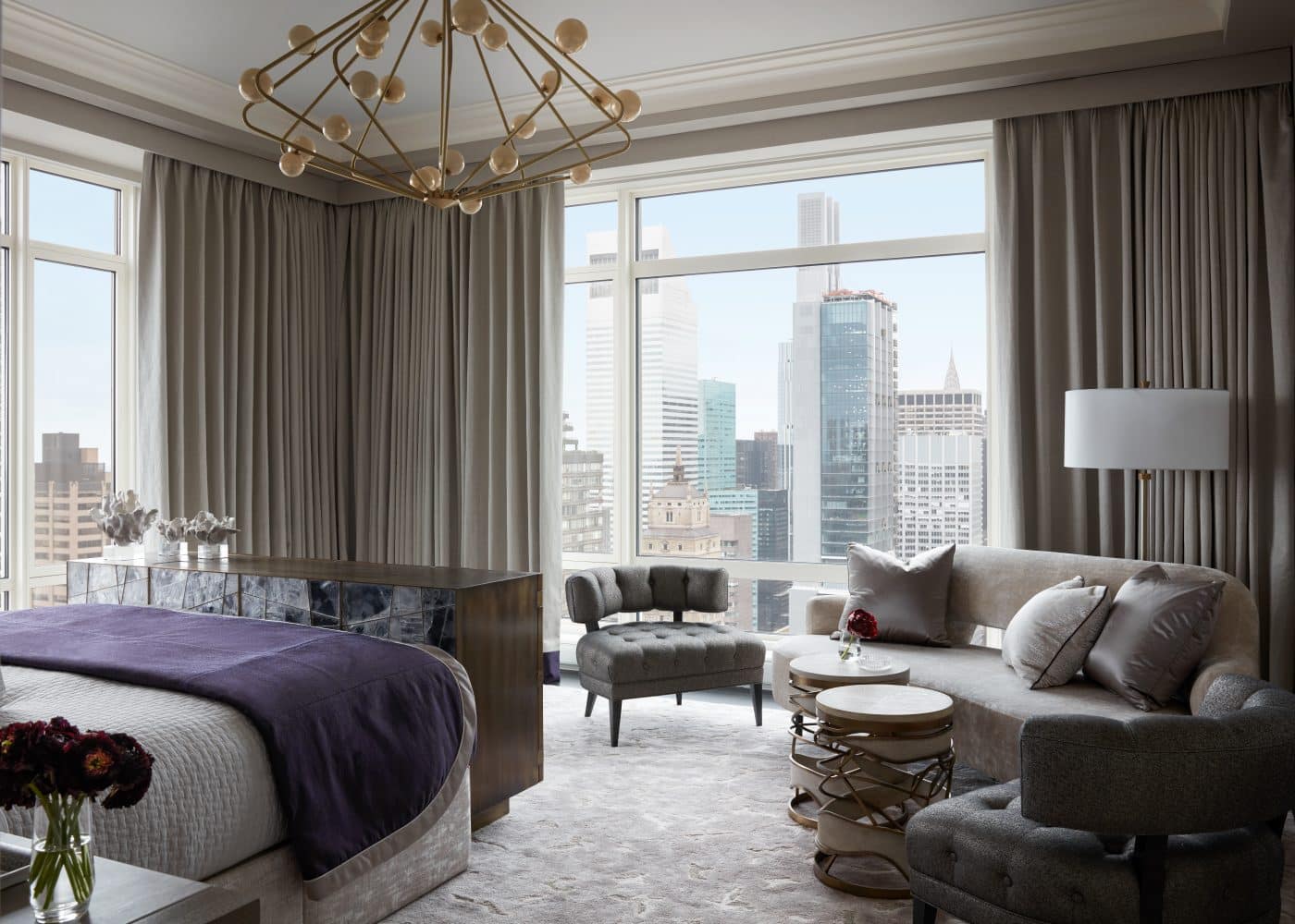Big-windowed main bedroom of Manhattan apartment designed by Drake/Anderson's Caleb Anderson Jamie Drake 