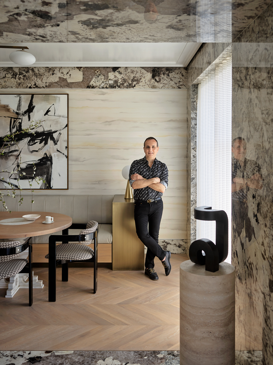 Australian designer Greg Natale photographed in the dining room of a villa he designed in the Sydney suburb of Mosman, from his new Rizzoli book The Layered Interior
