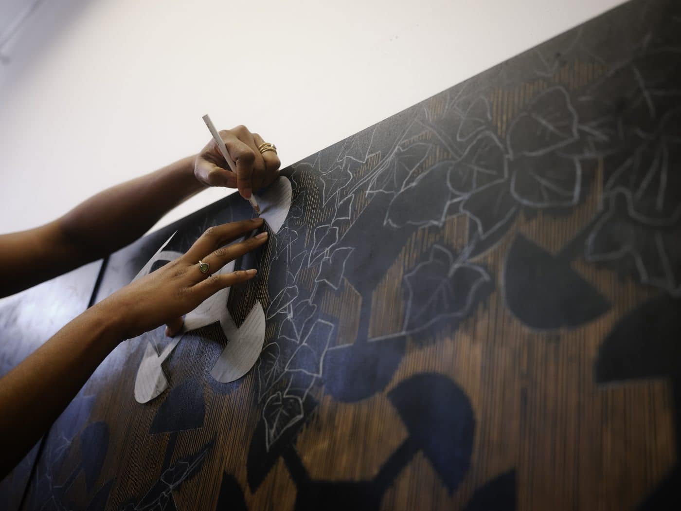 Artist LaToya M. Hobbs work on a woodcut panel in her Baltimore, MD, studio