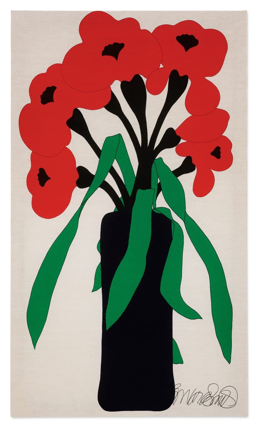 A textile depicting a black vase holding red flowers with black stems and green leaves on an off-white background, signed in the lower right corner by Howard Smith