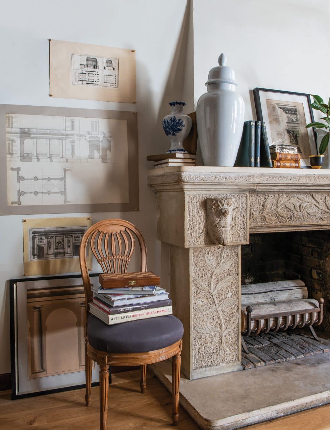 Interior designer David Jimenez atelier design studio on Paris's Île Saint-Louis from his book Parisian By Design published by Rizzoli fireplace and Montgolfier balloon-back chair 