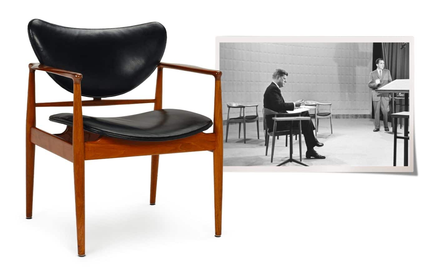 A Finn Juhl wood and leather chair next to a black-and-white photo of John F. Kennedy and Richard M. Nixon on stage with Hans Wegner chairs at the first televised presidential debate