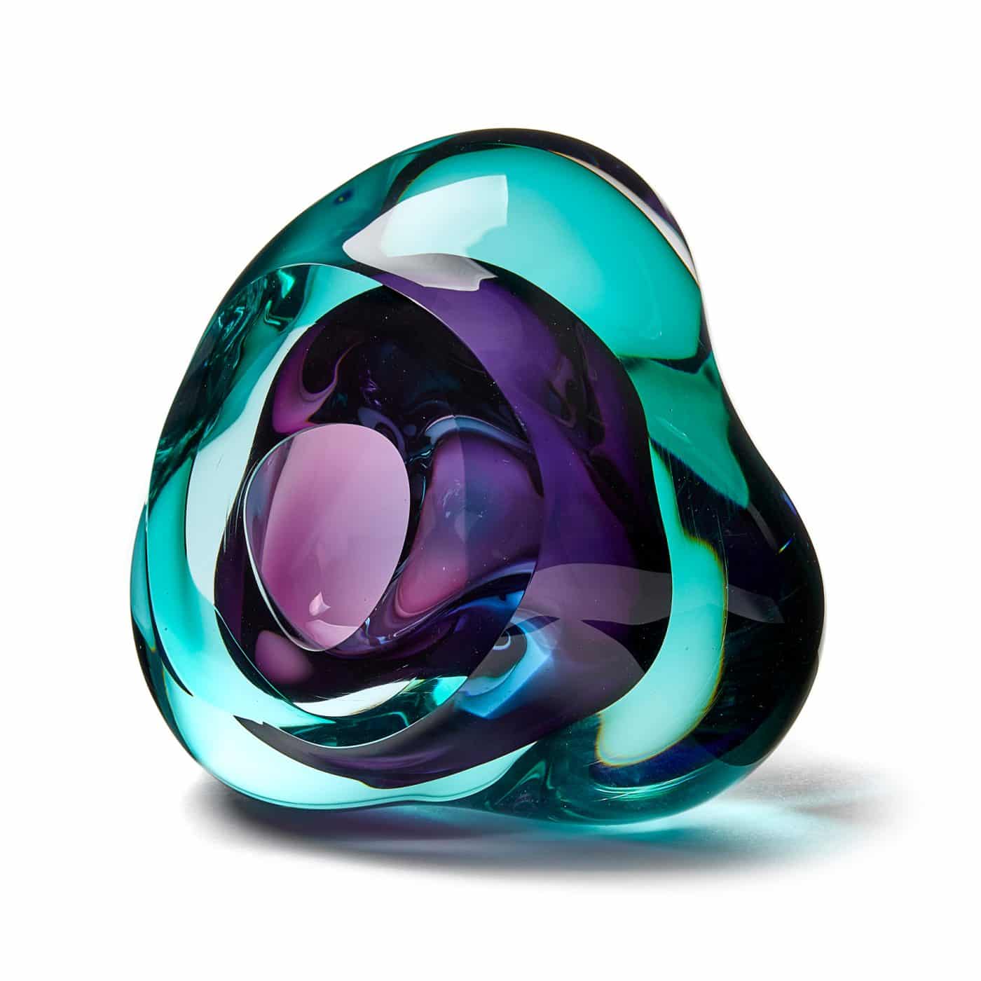 A green and purple glass sculpture by SAMANTHA DONALDSON