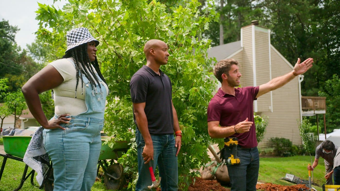 Danielle Brooks, Adair Curtis and Nick Cutsumpas survey a suburban yard in a still from the Nexflix show "Instant Dream Home."