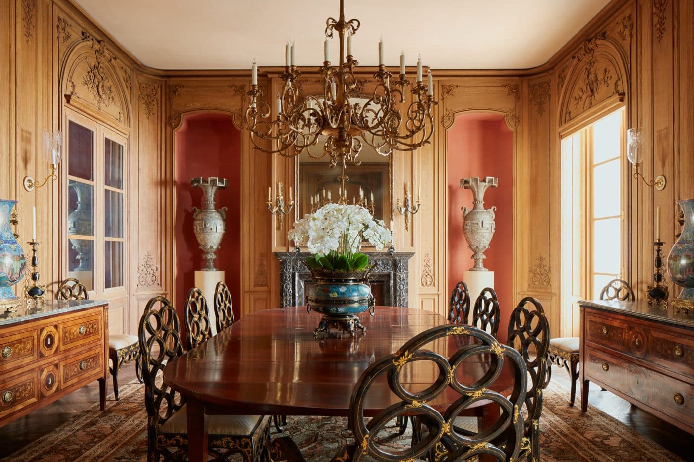 San Francisco neoclassical mansion dining room by interior designer Suzanne Tucker with French boiserie wall paneling, Chinese loop chairs 