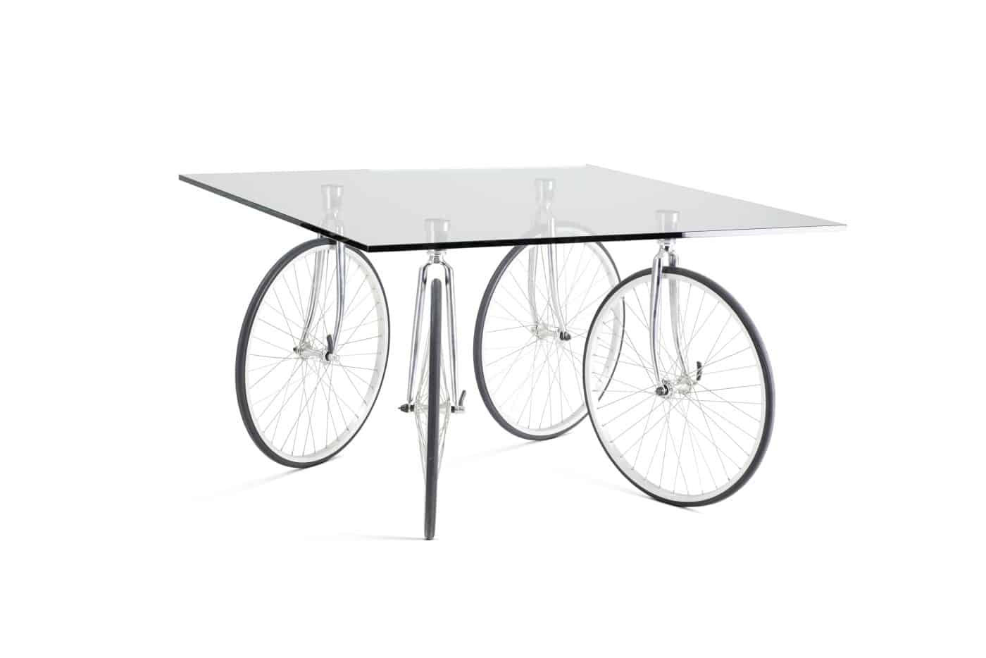 A glass-top table with bicycle wheels instead of legs
