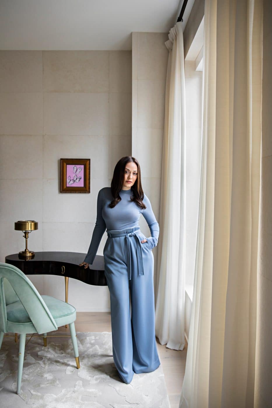 Interior designer Daun Curry portrait standing near desk in a project in Manhattan