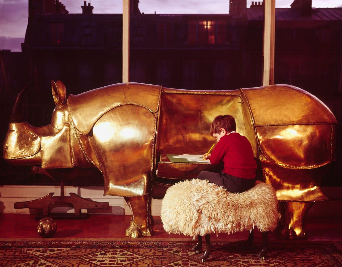 Golden rhinocerus statue sculpture with drop-down fold-out desk created by French artist and designer François-Xavier Lalanne. Head is a coin bank. Sheep stool Assouline book Lalanne: A World of Poetry