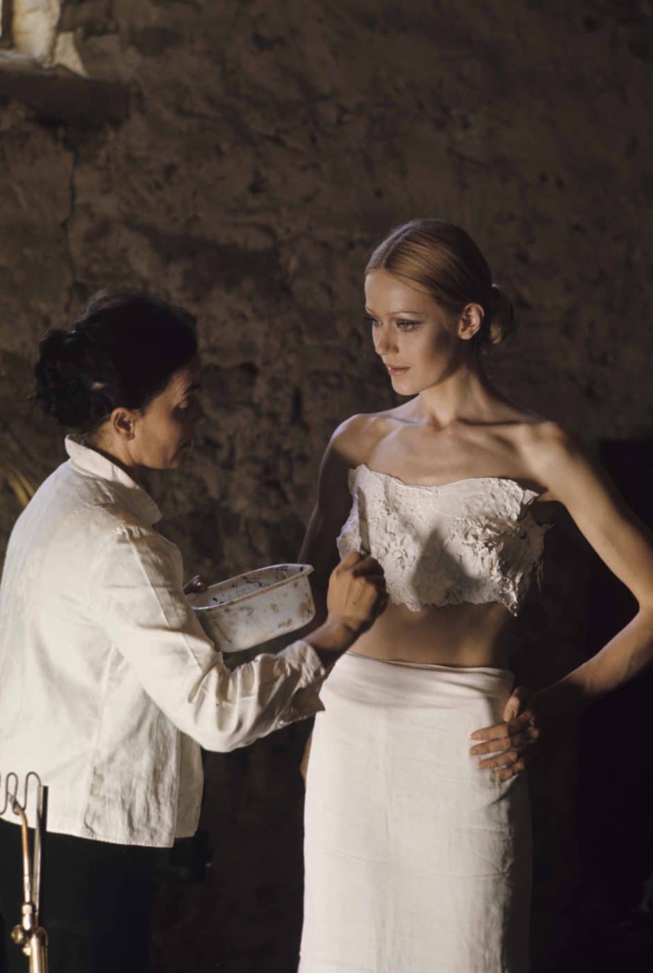 French artist and designer Claude Lalanne creating a plaster cast of a model's torso in order to create a golden body sculpture for Yves Saint Laurent's 1969 fall/winter haute couture collection Assouline book Lalanne: A World of Poetry