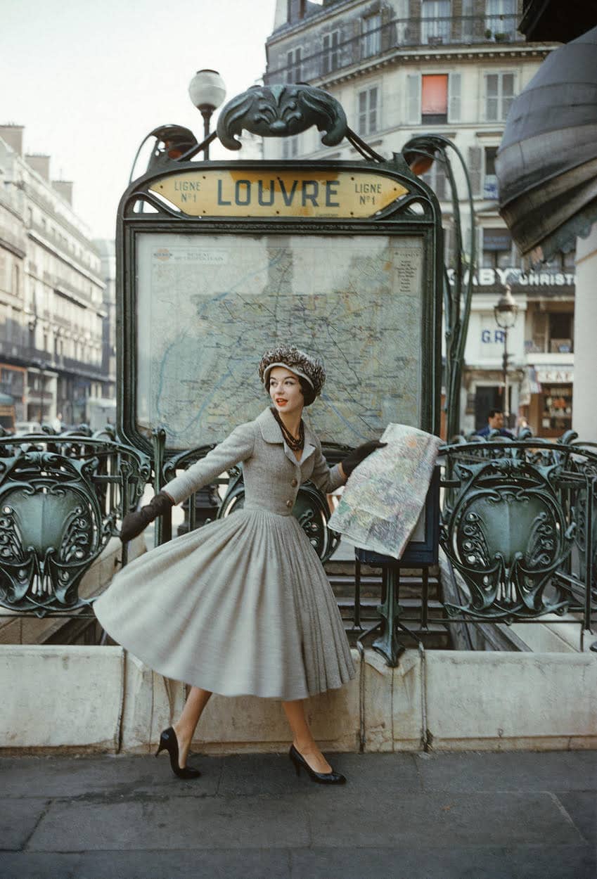 Dior model in front of Art Nouveau Paris metro station entrance designed by Hector Guimard