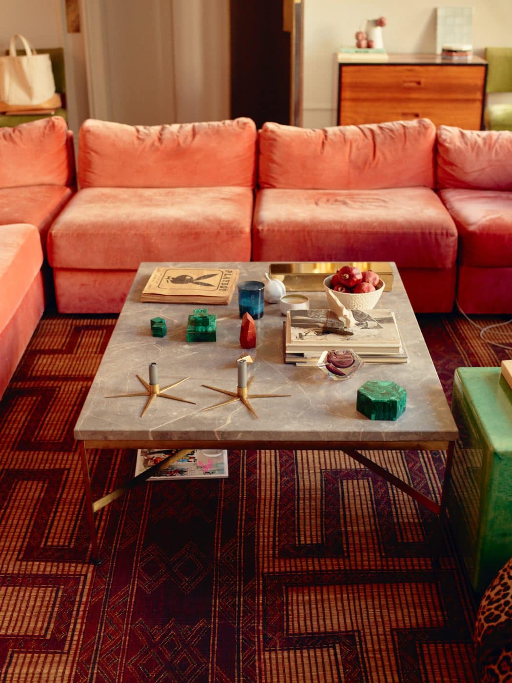 The Paul McCobb coffee table and pink Milo Baughman sectional sofa in Jenna Lyons' Soho loft