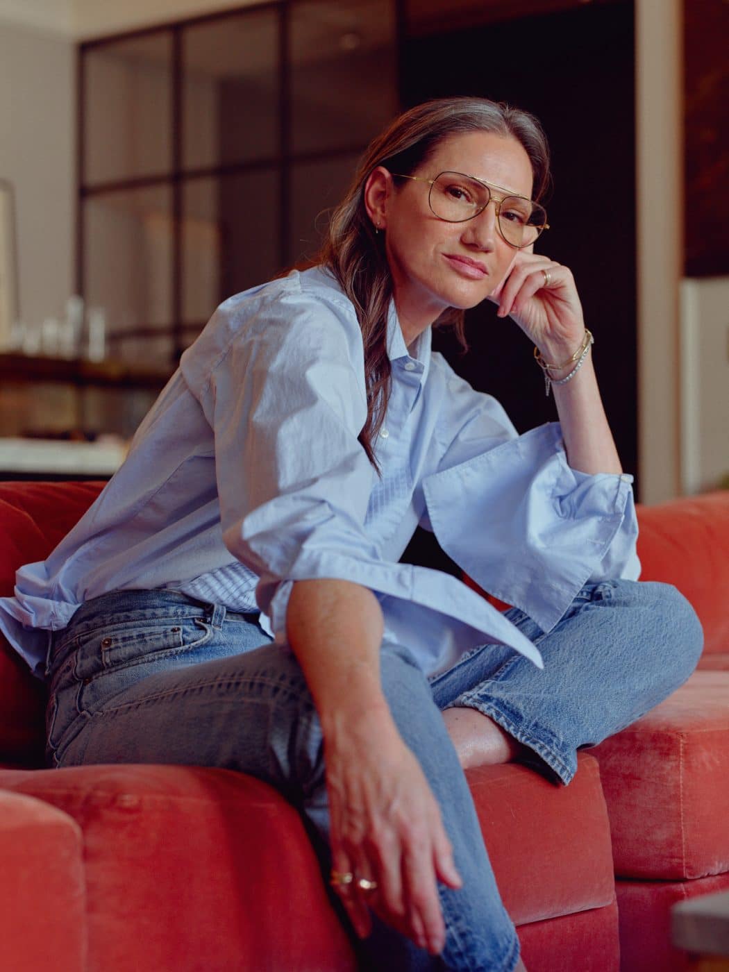 Jenna Lyons on the living room sofa in her Soho loft