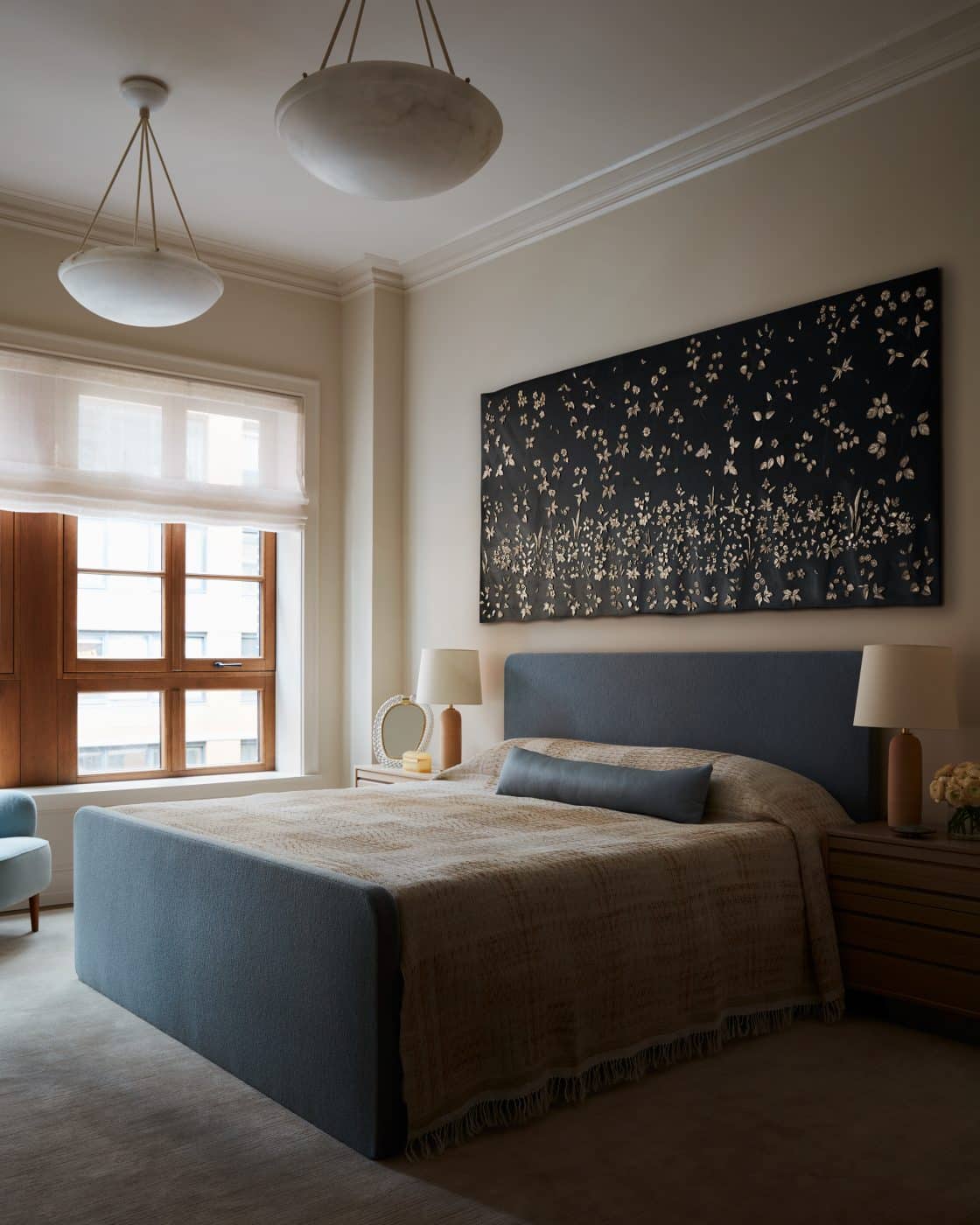 Primary bedroom of apartment in Fitzroy building in New York City by interior designer Shawn Henderson