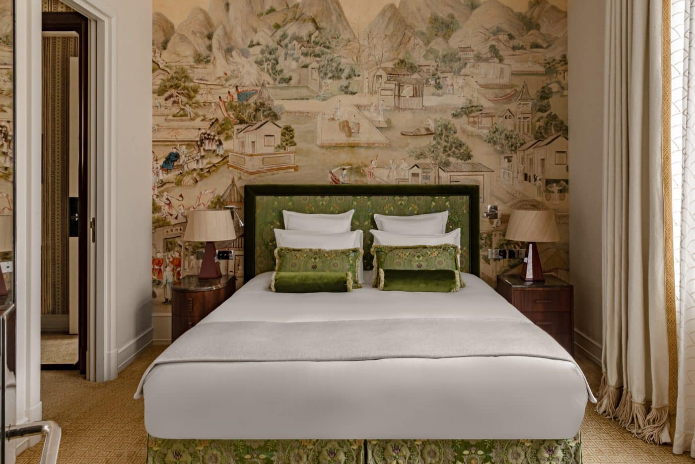 ​Gonzalez designed the b​edside tables and lamps ​for ​the Saint James. Iksel ​produced the ​Japanese-inspired wall covering. Lelièvre made the upholstery on the headboard, pillows and bedskirt, and the wall fabric is ​​Pierre Frey​.​