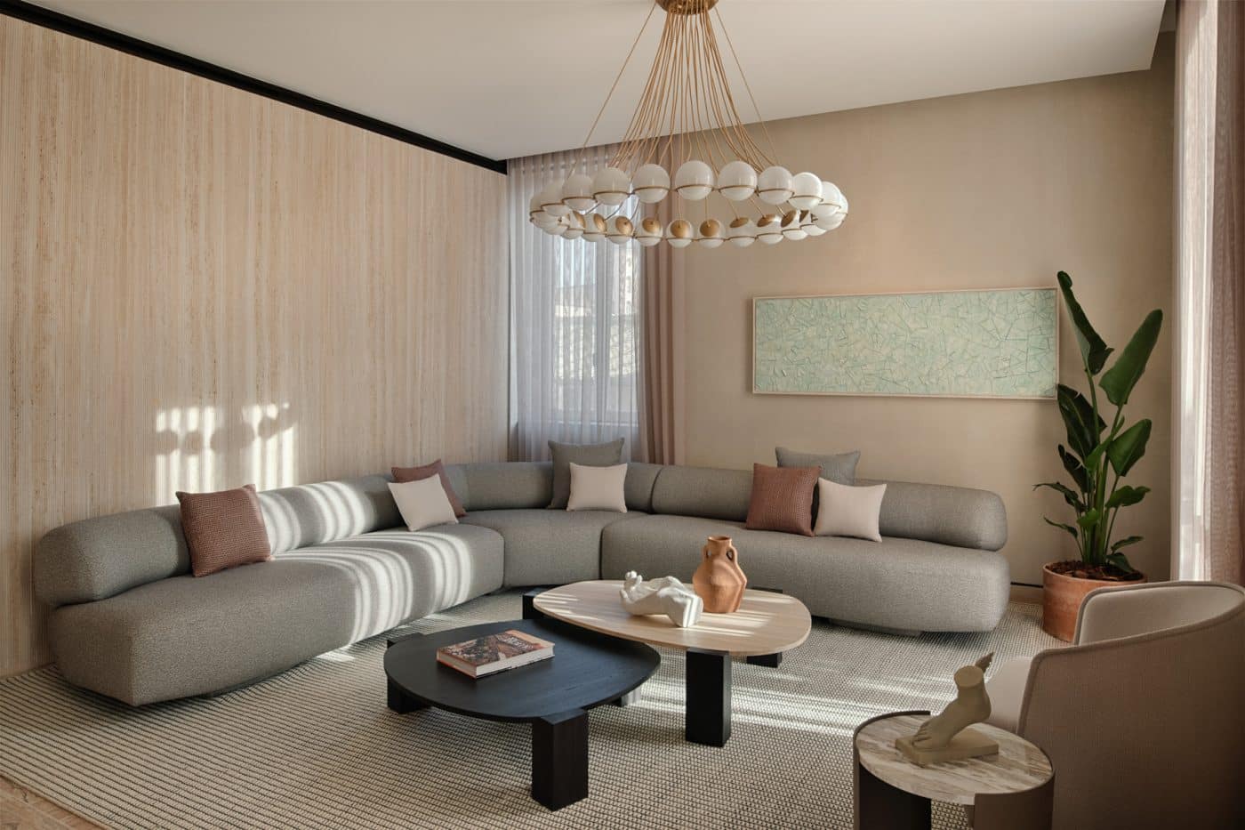 At the Six Senses Rome, Patricia Urquiola outfitted the living room of the Lata Suite in a sectional sofa and coffee table from her Gogan collection for Moroso, 2019; a Le Sfere chandelier by Gino Sarfatti for Astep; Metamosaic, a 2023 painting by Paolo Polloniato; and a bespoke rug Urquiola designed for the hotel. 
