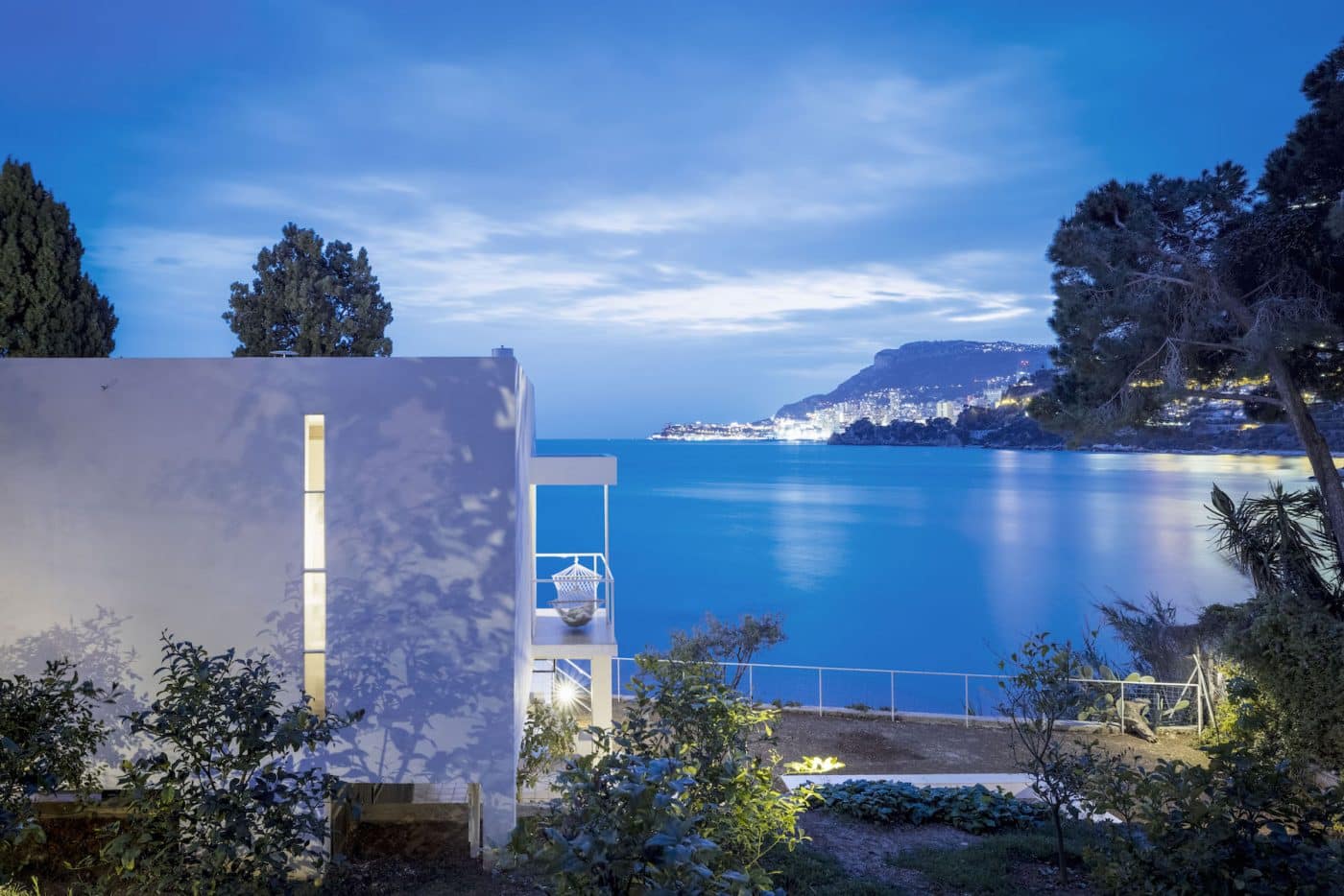 A twilight view of the Baie de Roquebrune and Monte Carlo from behind Eileen Gray's E-1027.