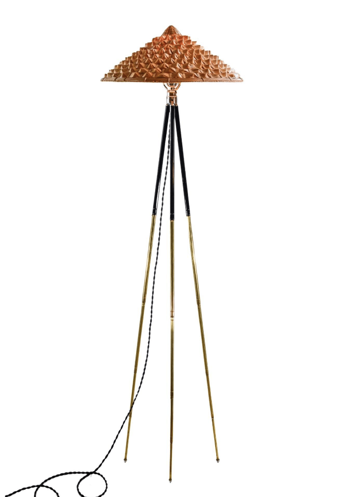 A Tennant New York lamp with an antique German camera tripod for a base and a woven grass shade