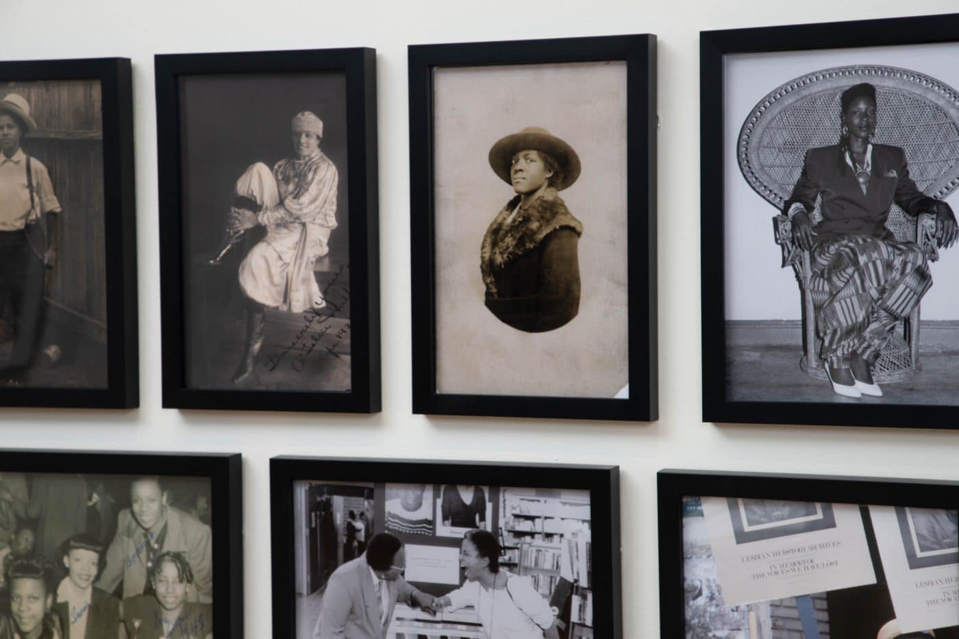 Framed black-and-white photographs of Black people in different eras from the exhibition "Images on Which to Build, 1970s–1990s" at the Leslie-Lohman Museum of Art