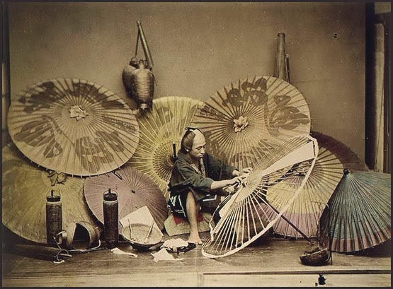 A photograph of an early-20th-century Japanese parasol maker 
