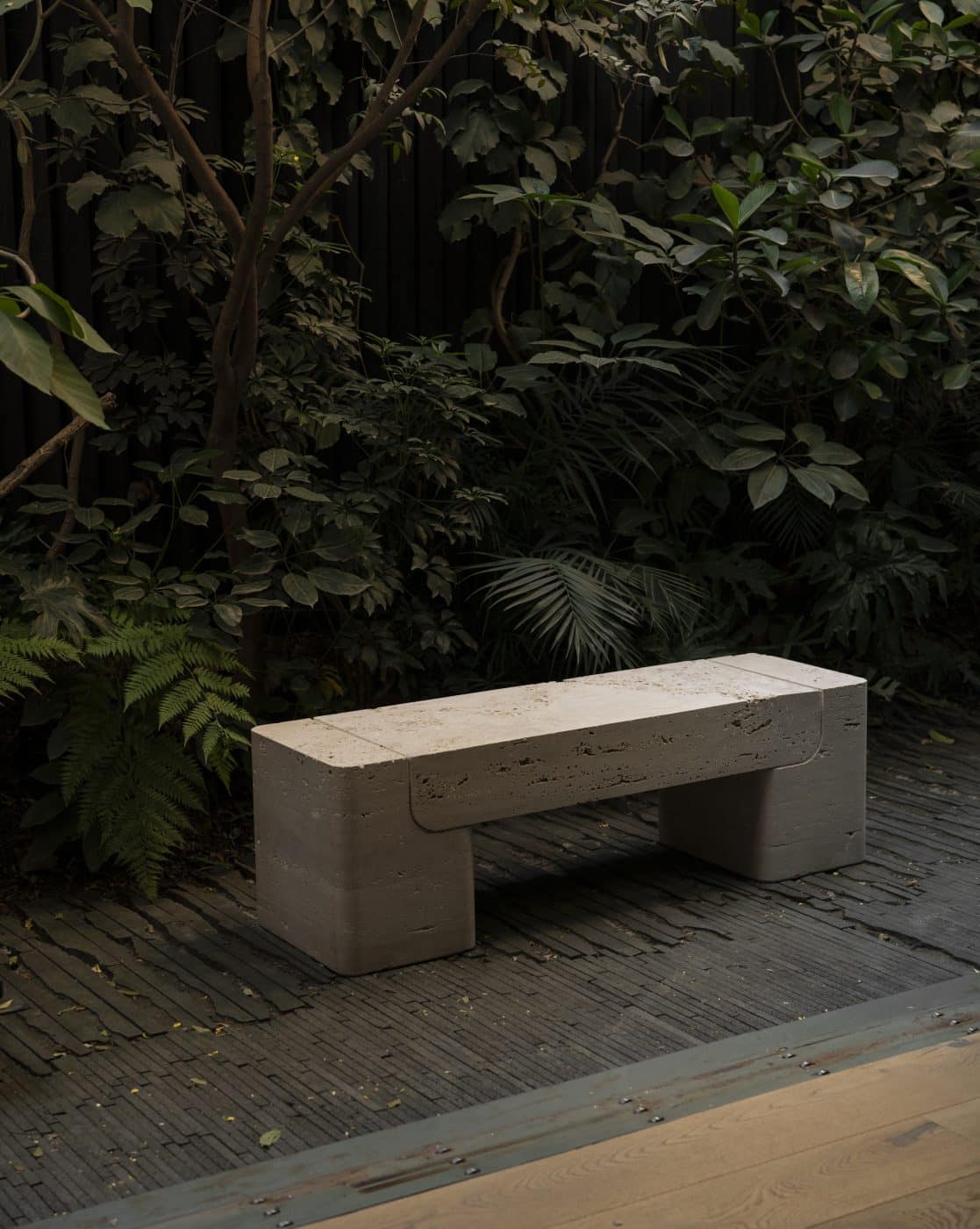 Monolith bench in travertine