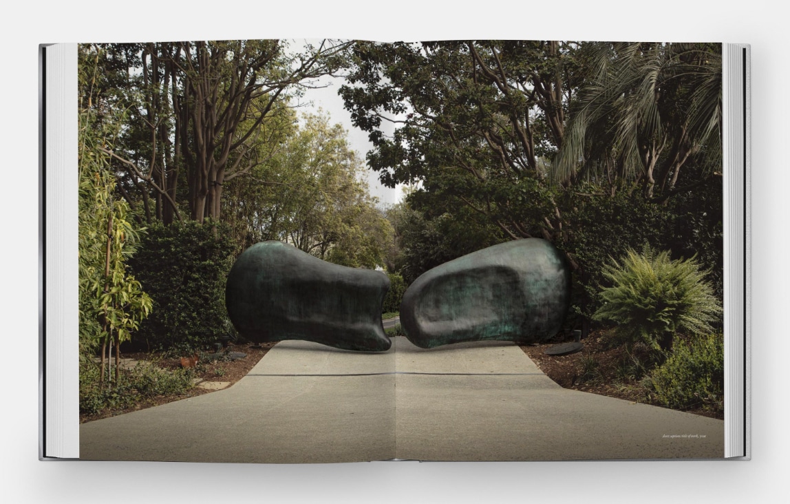 a spread from the monograph "Rogan Gregory: Event Horizon" showing a monumental gate in oxidized bronze surrounded by green trees and shrubs