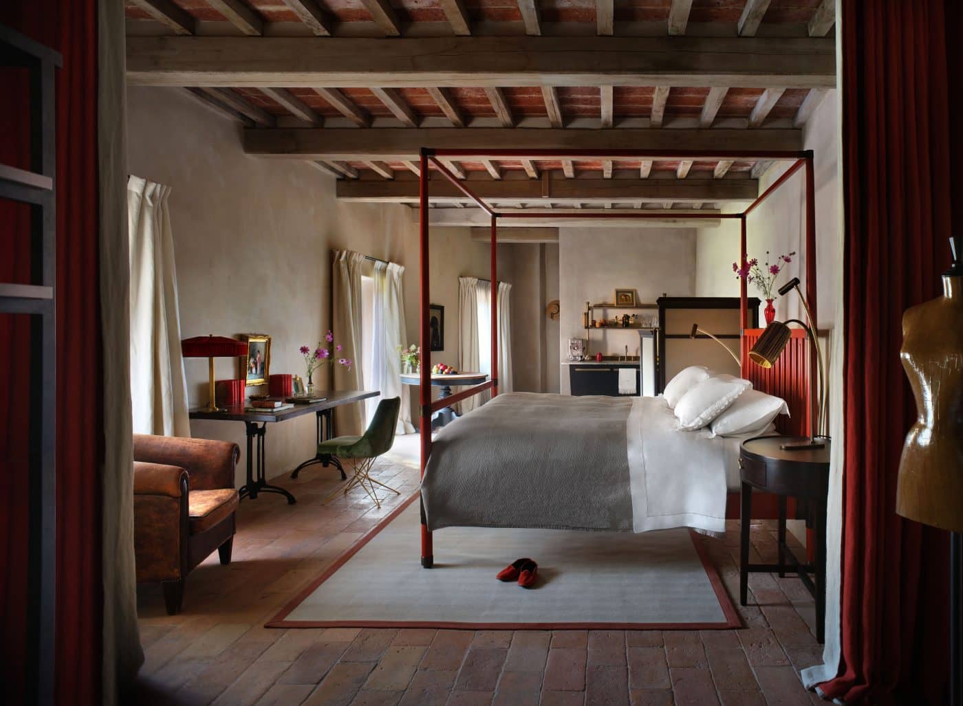 view of a suite at the Castello di Reschio hotel with B.B for Reschio campaign bed
