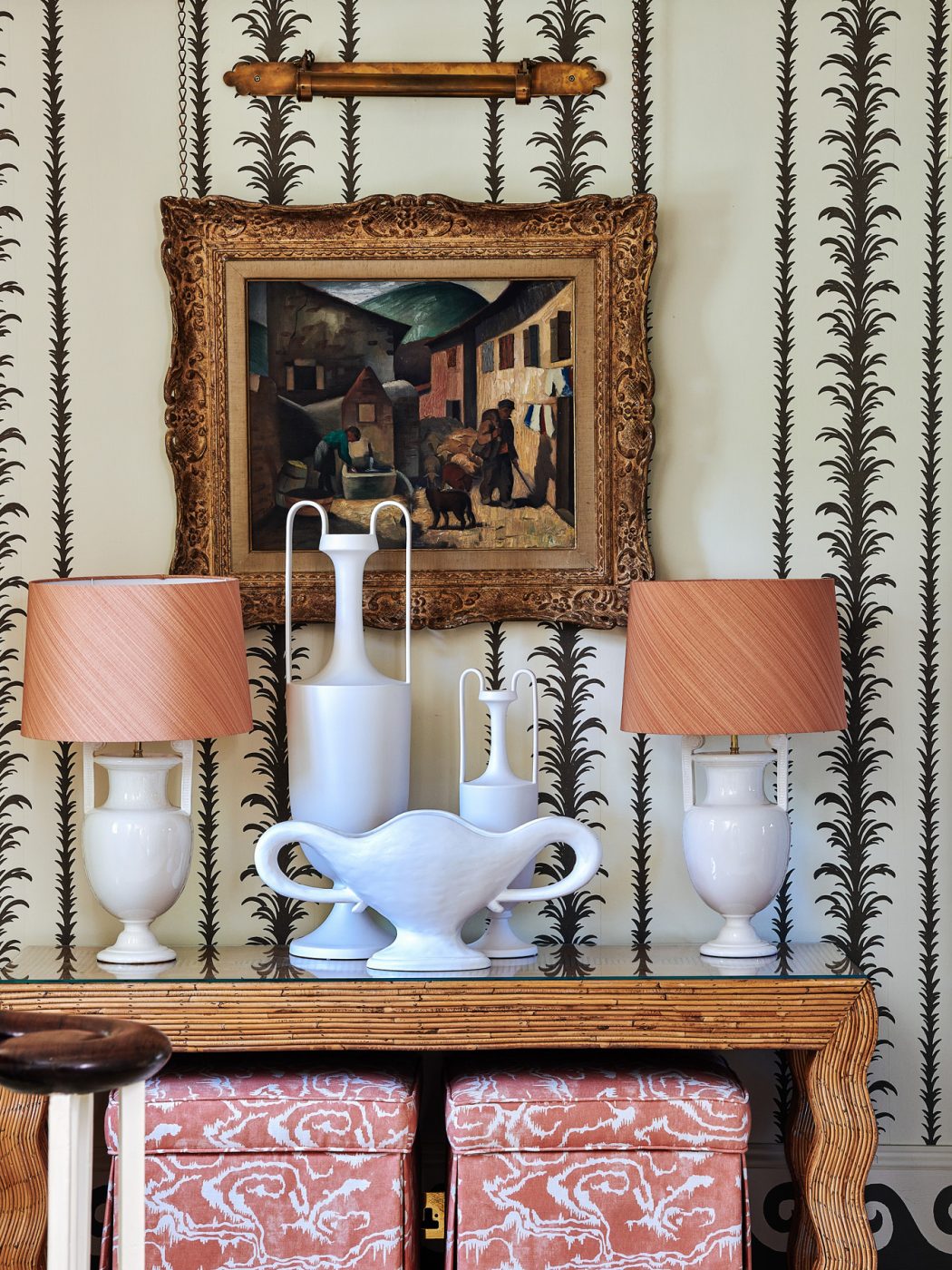 Cotswold House foyer with wavy console table, white ceramic vessels and table lamps