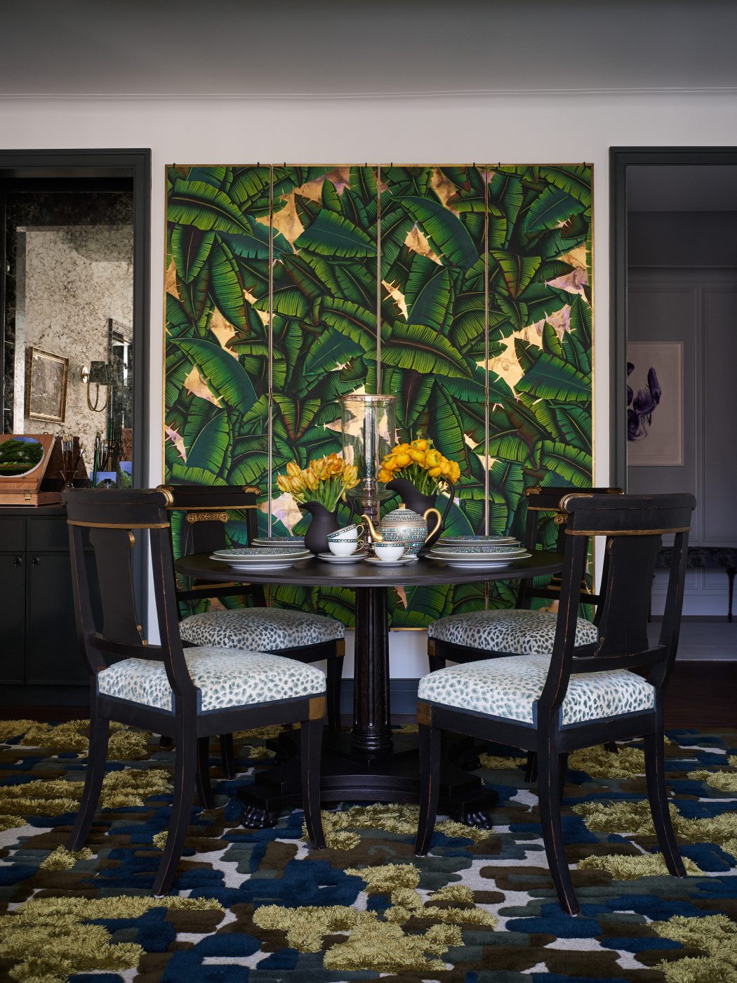 wall-mounted De Gournay wallpapered screen in the dining area of Bennett Leifer's New York apartment