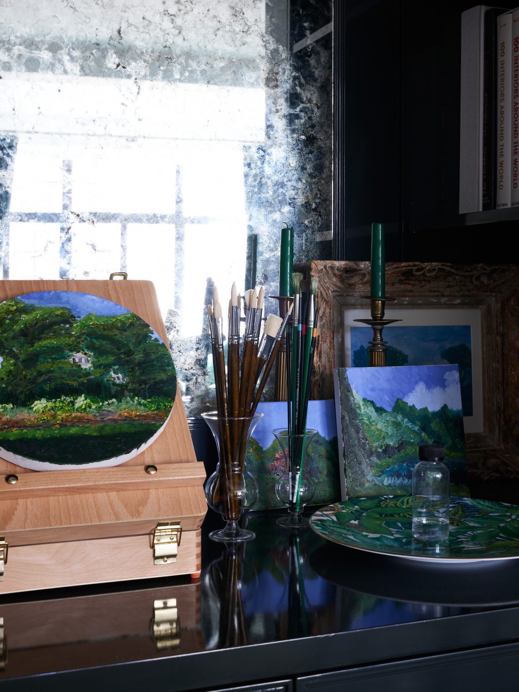 view of Bennett Leifer's paintings and paintbrushes in a bar area in his home that he now uses as a studio